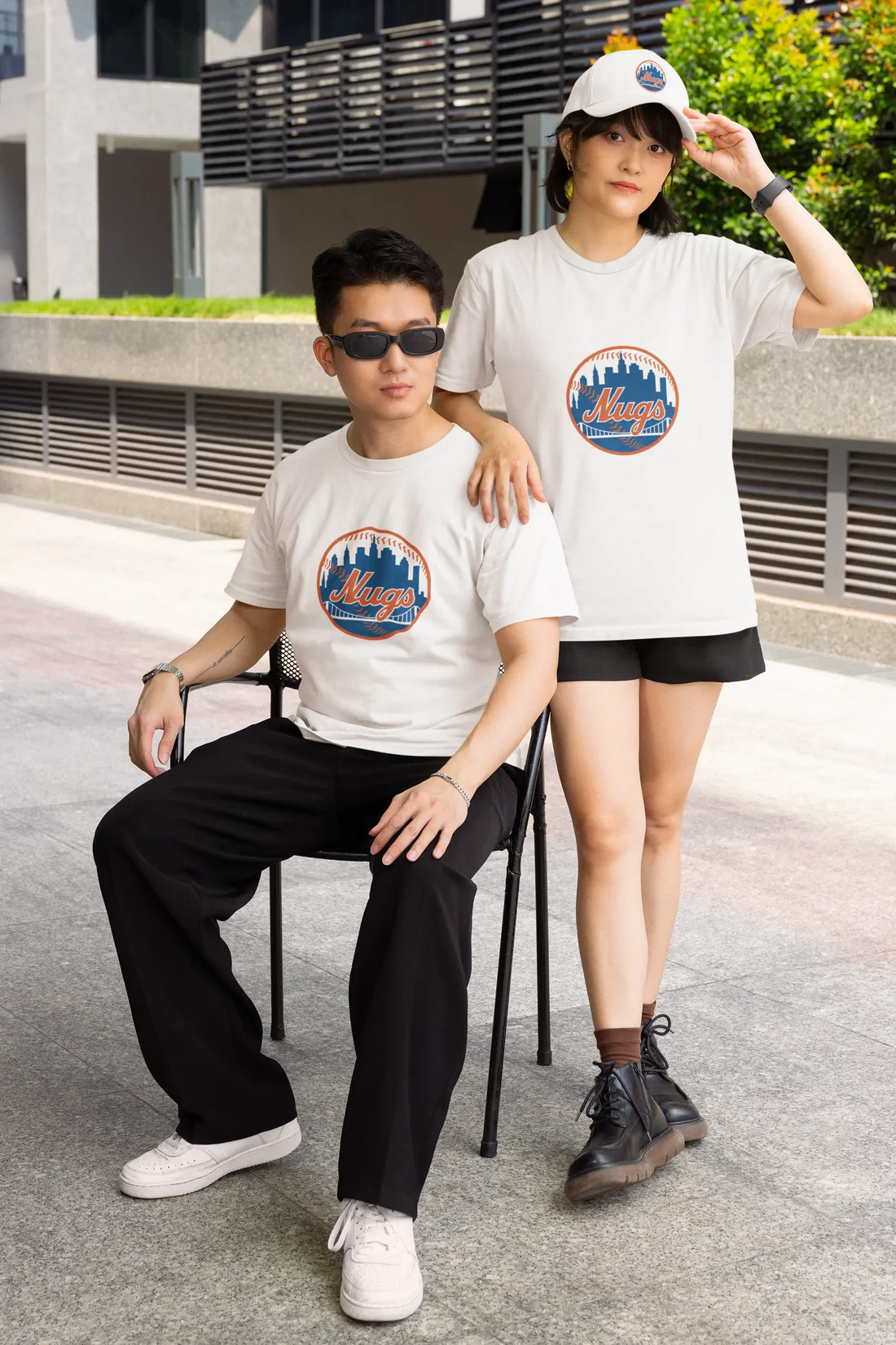 Two people wearing New York Nugs shirts and Dad Hat posing outdoors
