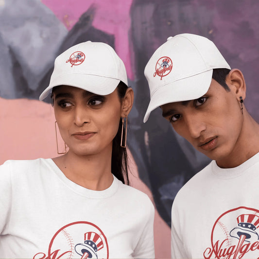 Two models wearing the New York Nuggets White Dad Hat and matching shirts in front of a colorful wall
