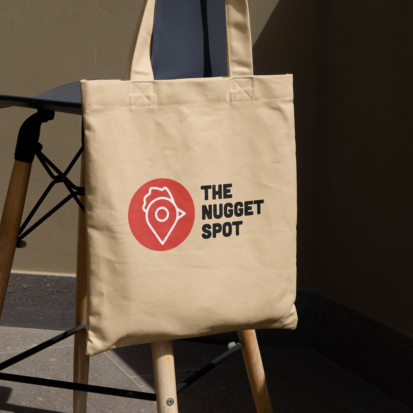 Tote bag displayed on chair in natural lighting