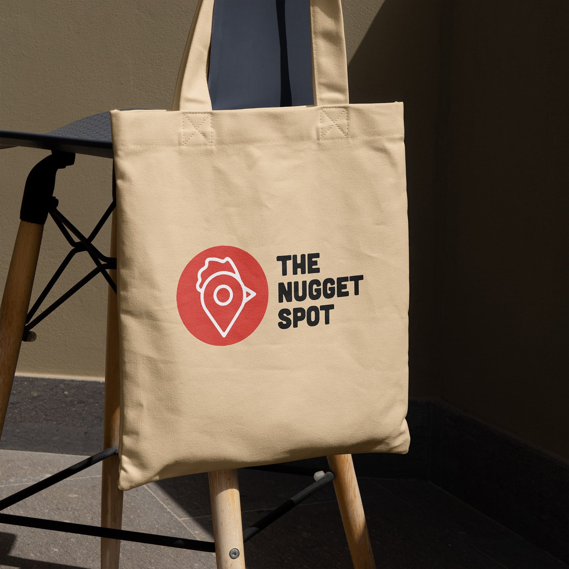 Tote bag displayed on chair in natural lighting