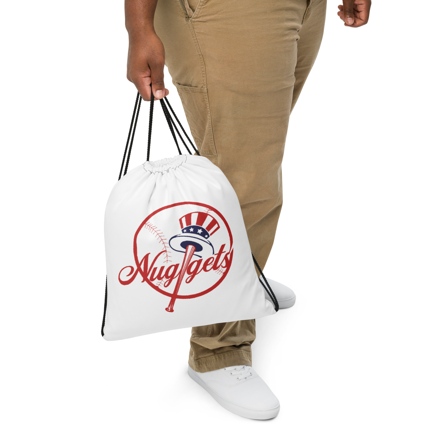 Man wearing the New York Nugget drawstring bag over his shoulder.