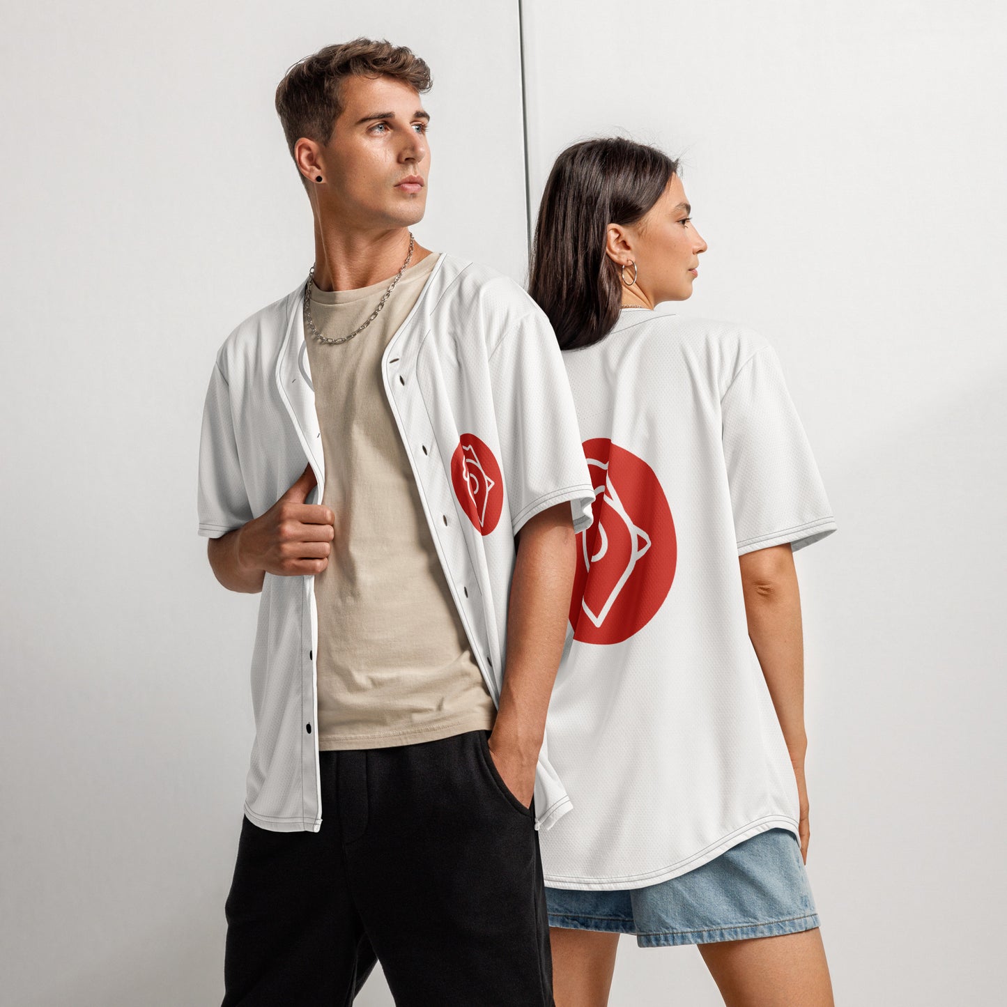 Man and woman posing in The Nugget Spot Signature Baseball Jerseys, front and back views
