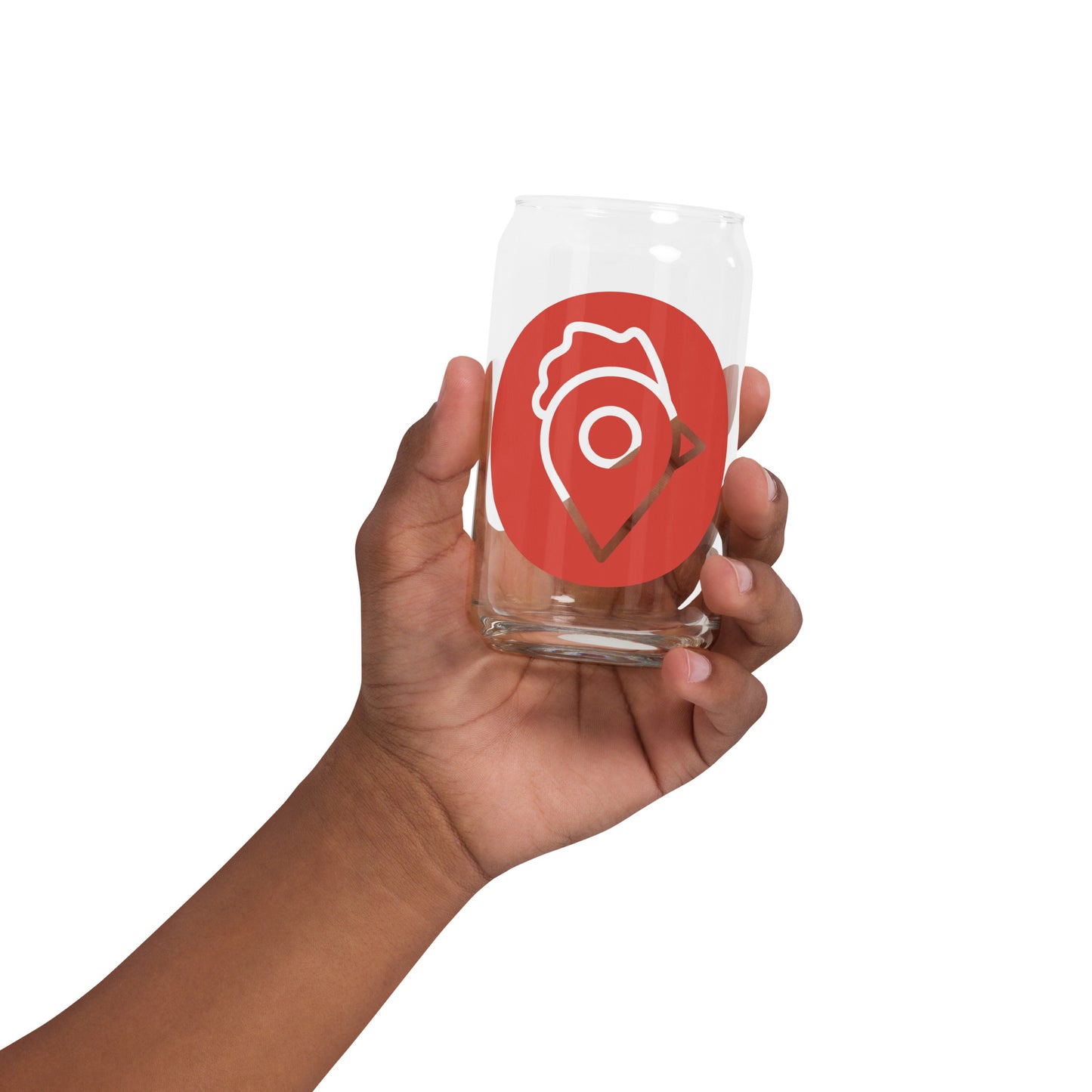 A hand holding The Nugget Spot clear glass showing the printed red logo.
