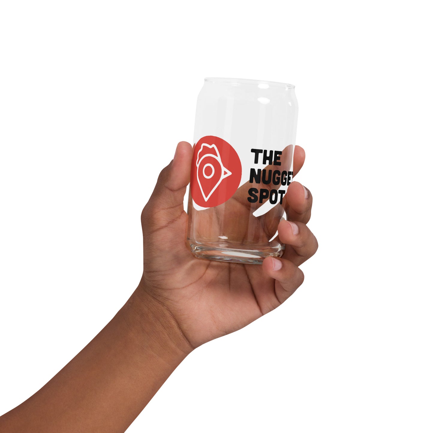 Hand holding The Nugget Spot 16oz clear can glass