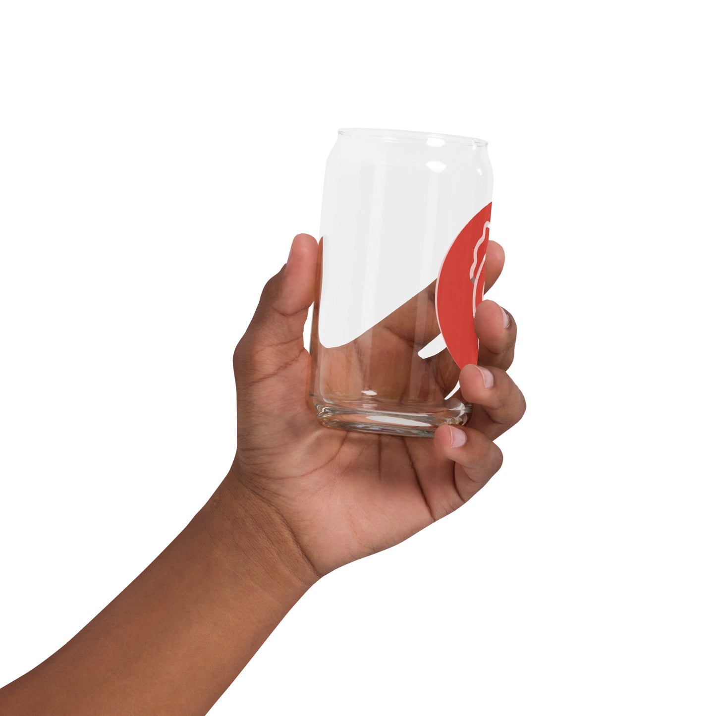 A side view of the same hand holding the glass and straw at an angle.
