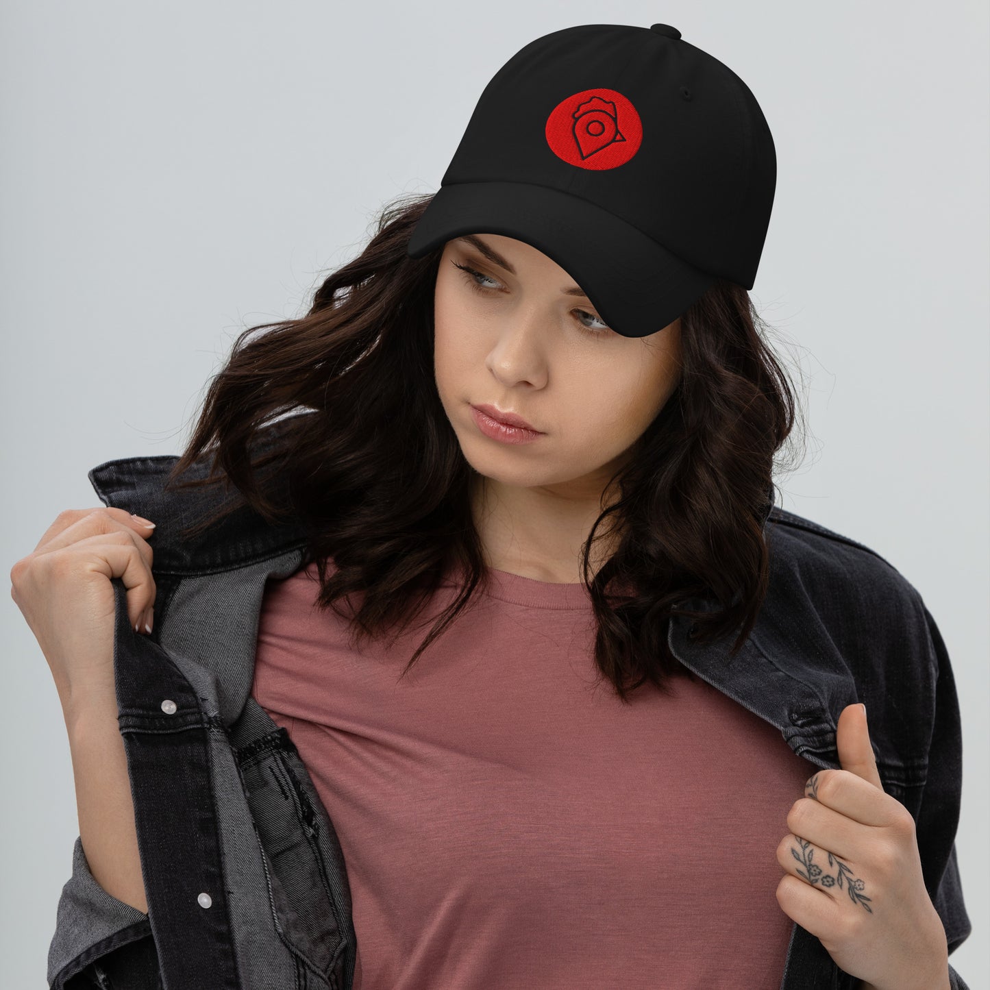 Model in black denim jacket wearing black Nugget Spot Signature Dad Hat.