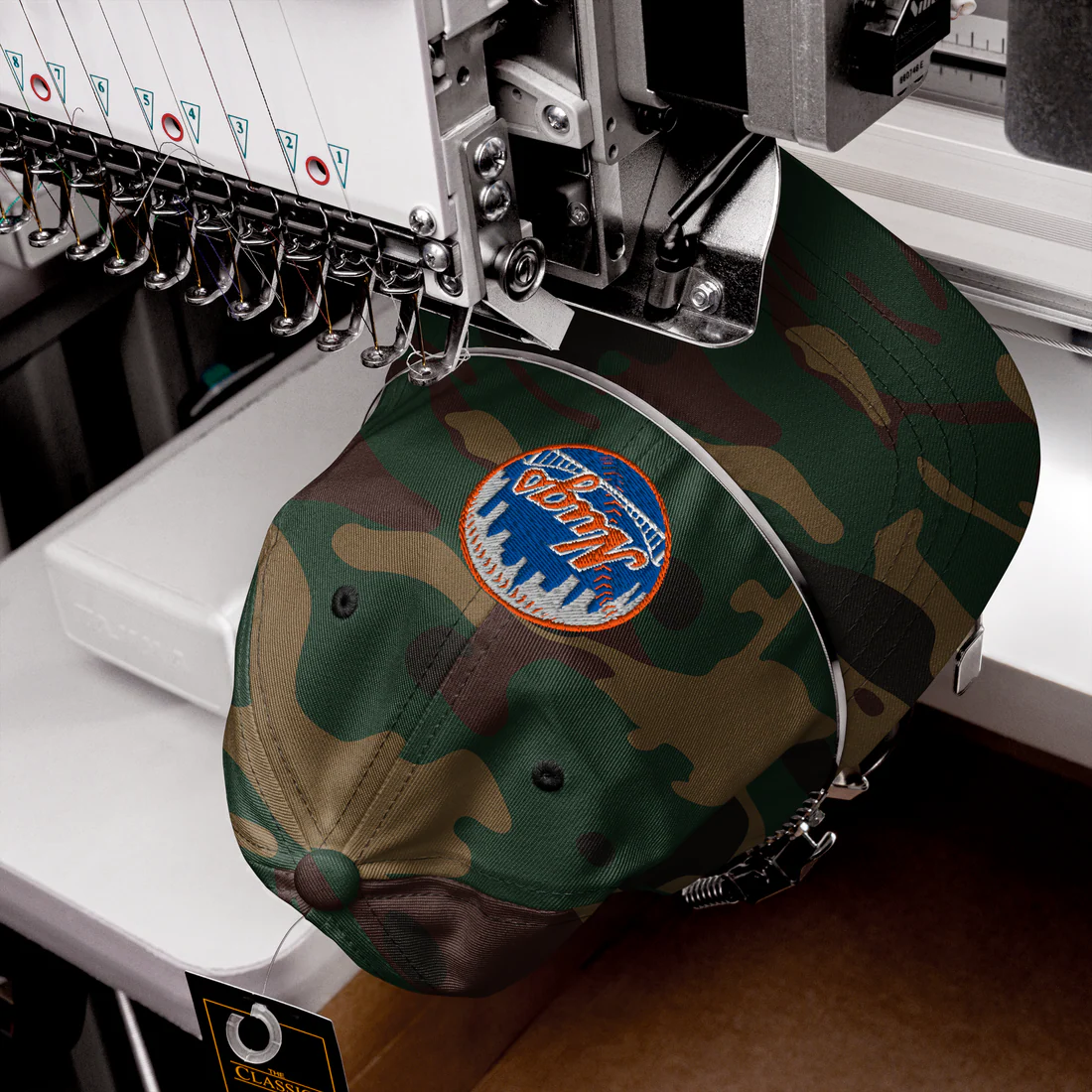 Camo New York Nugs Dad Hat being embroidered in a production machine