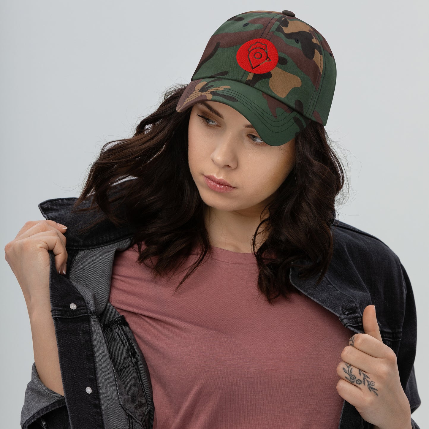 Model in black denim jacket wearing black Nugget Spot Signature Dad Hat.