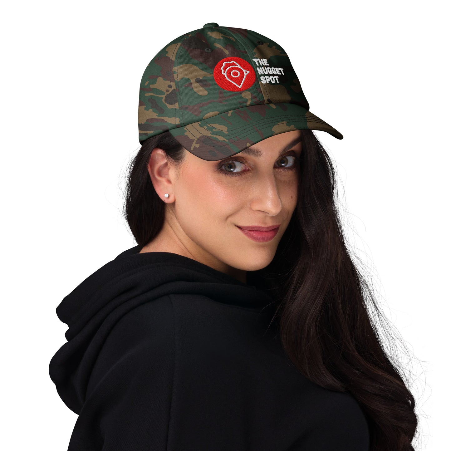 Side view of woman wearing camo The Nugget Spot dad hat, showing embroidered front design.