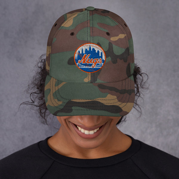Woman smiling while wearing the camo New York Nugs Dad Hat with embroidered logo
