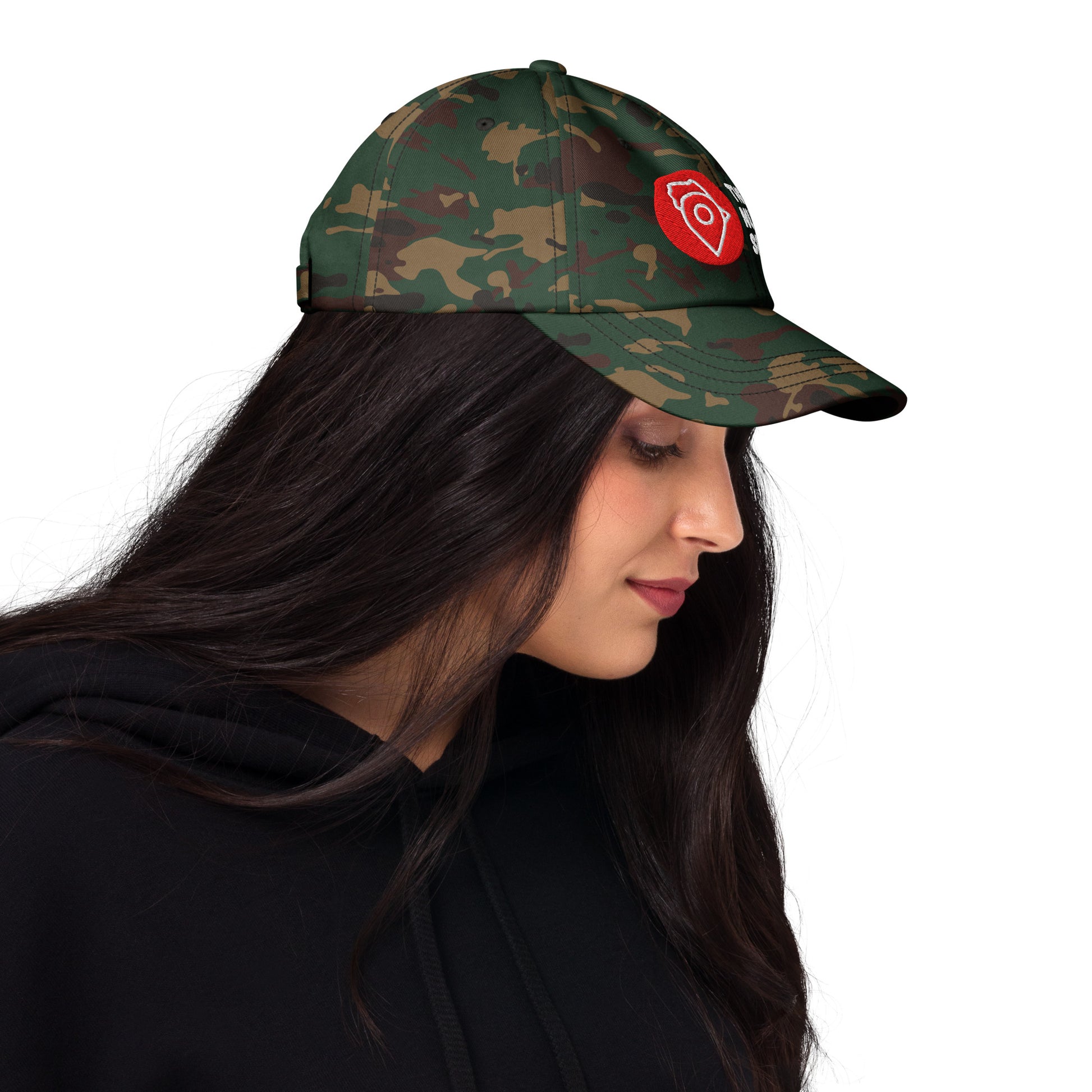 Side view of woman wearing camo The Nugget Spot dad hat, showing embroidered front design.