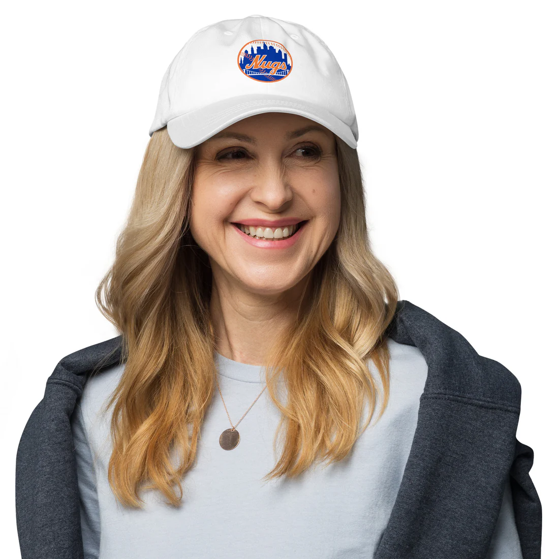 Woman smiling while wearing the white New York Nugs Dad Hat with embroidered logo