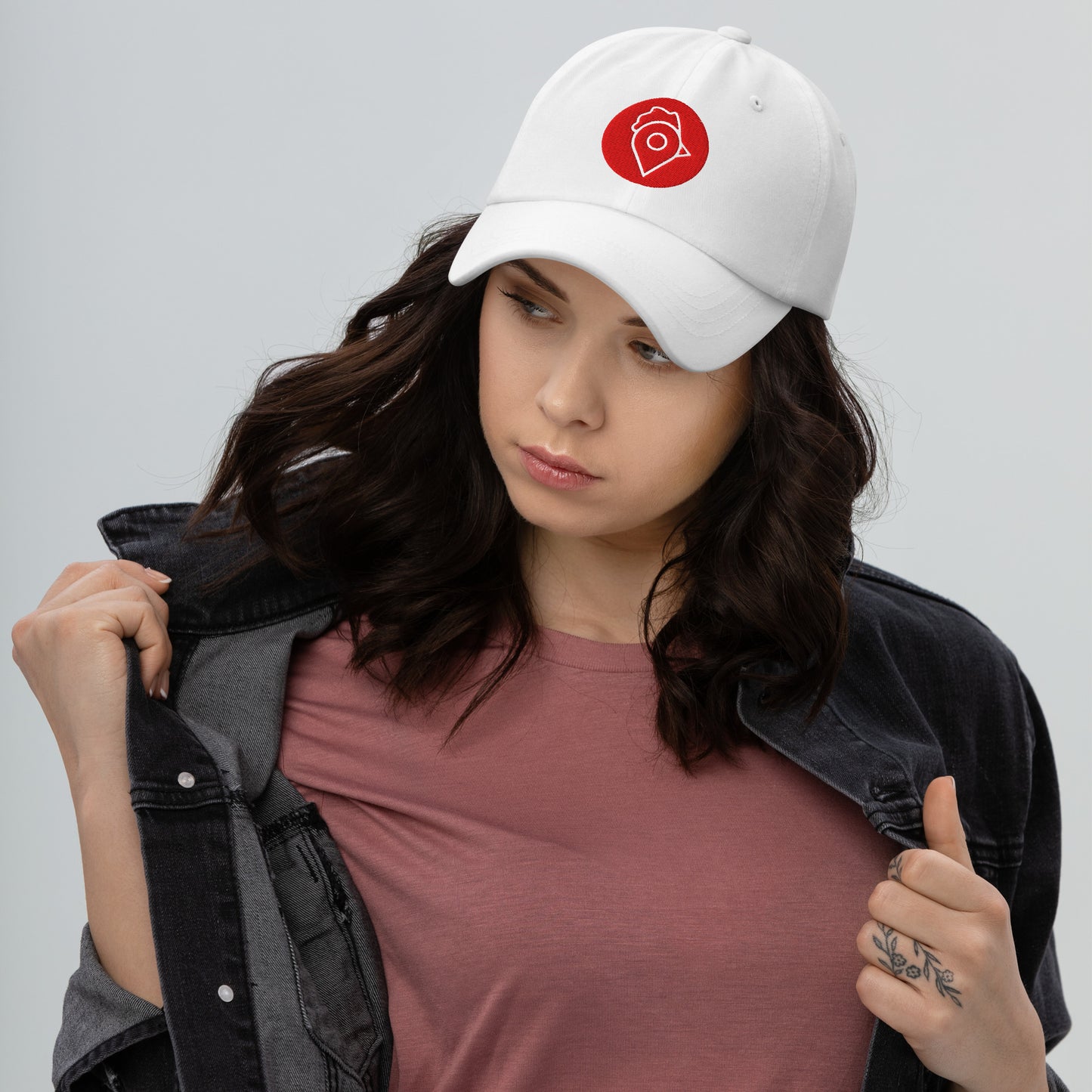Model in black denim jacket wearing black Nugget Spot Signature Dad Hat.