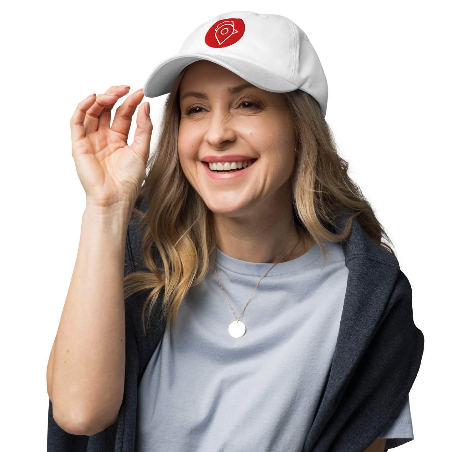 Smiling woman wearing white Nugget Spot Signature Dad Hat with casual outfit.