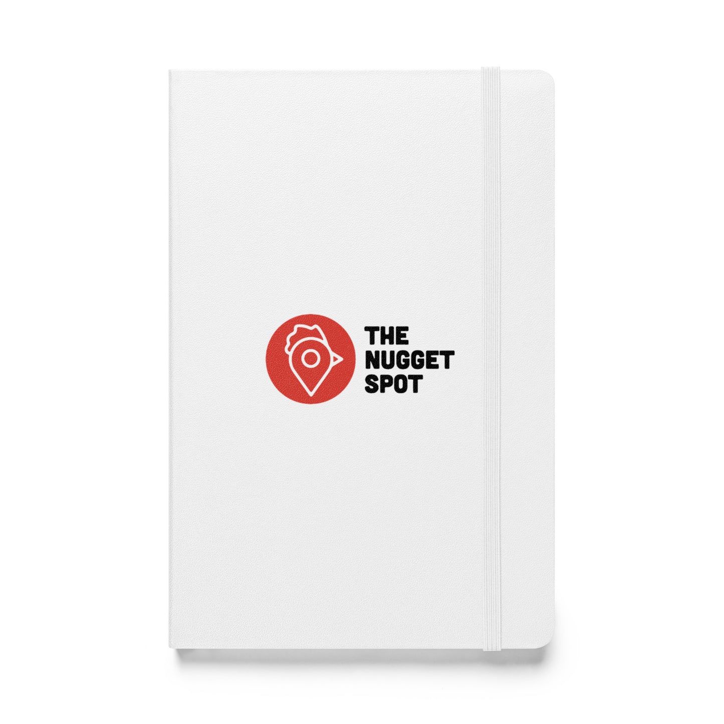 Close-up front view of The Nugget Spot white hardcover notebook with elastic closure.
