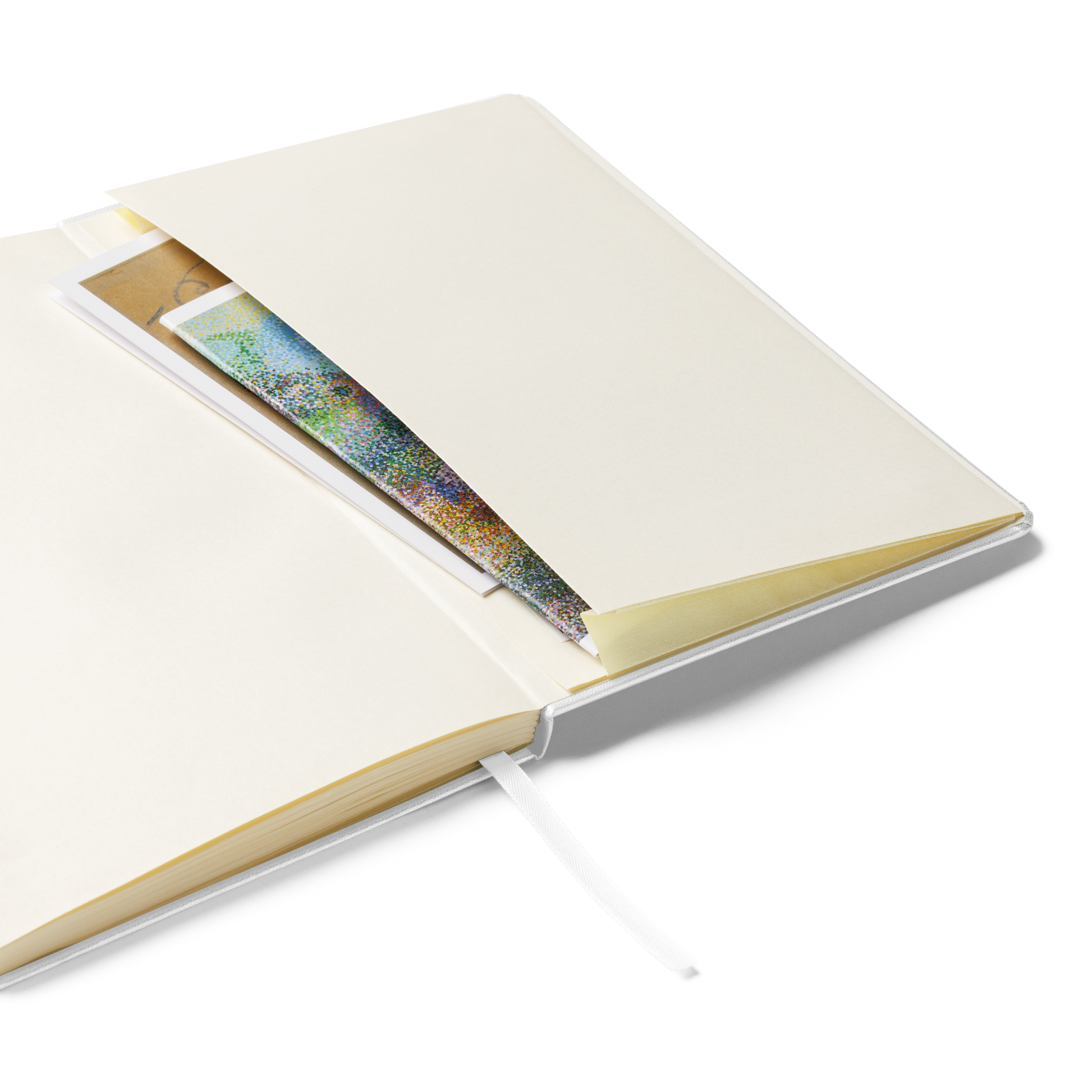 Open notebook showing cream pages and inner expandable pocket with inserted papers