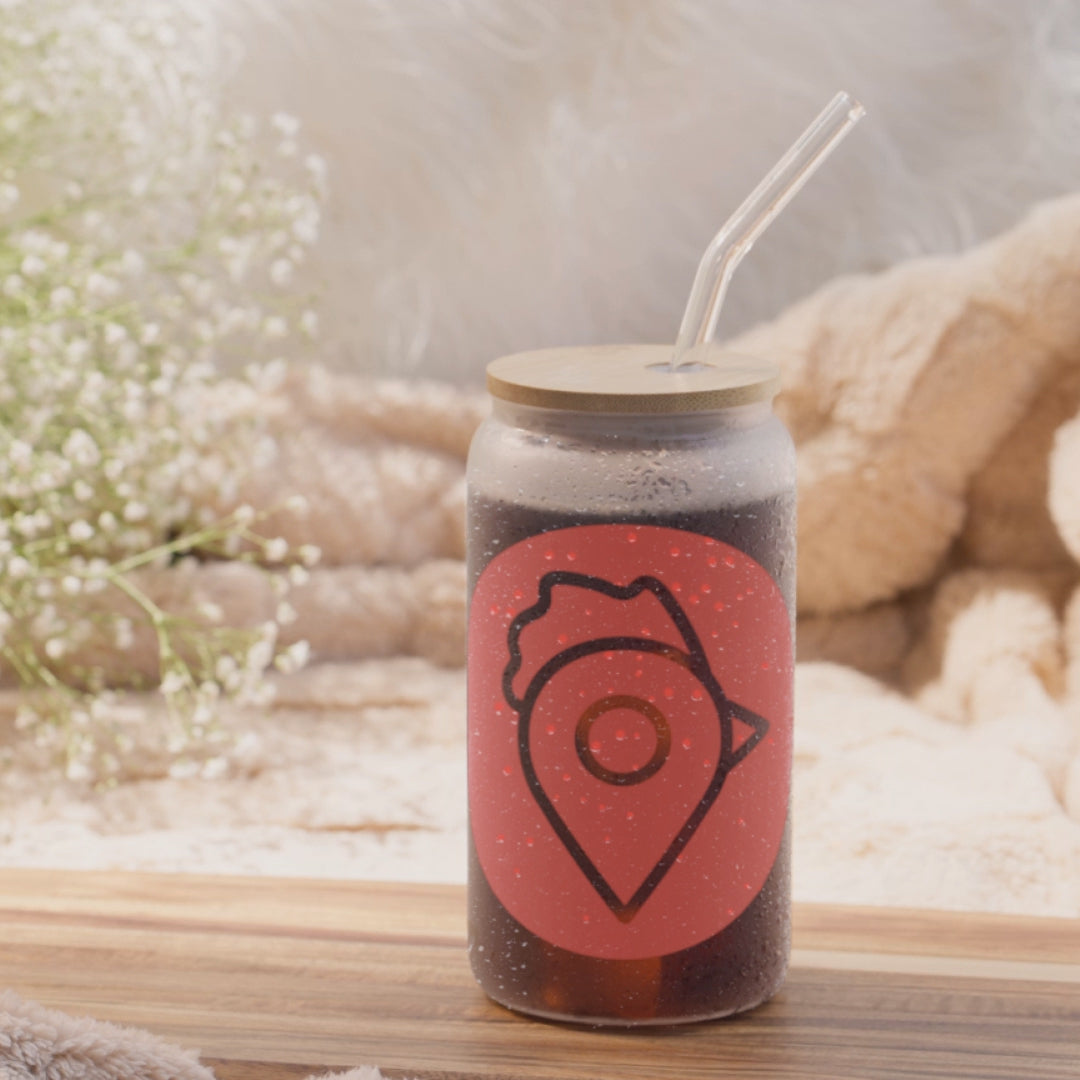 view of The Nugget Spot Signature 16oz can-shaped glass showcasing its design, bamboo lid, and straw in motion