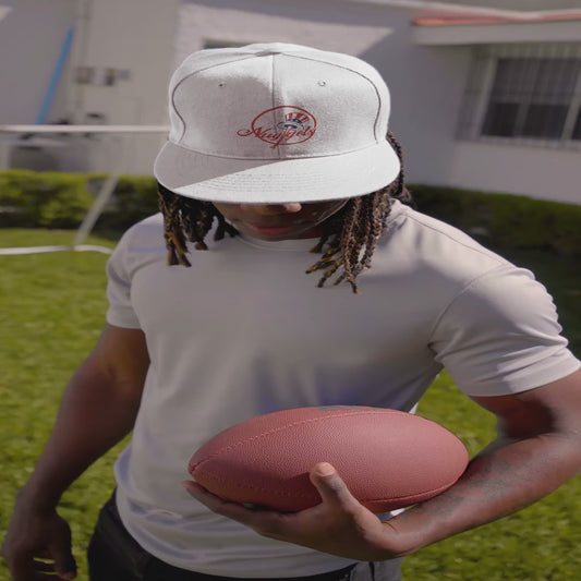 Showcase of the white New Your Nuggets dad hat featuring red embroidered logo, adjustable strap, and clean streetwear design.