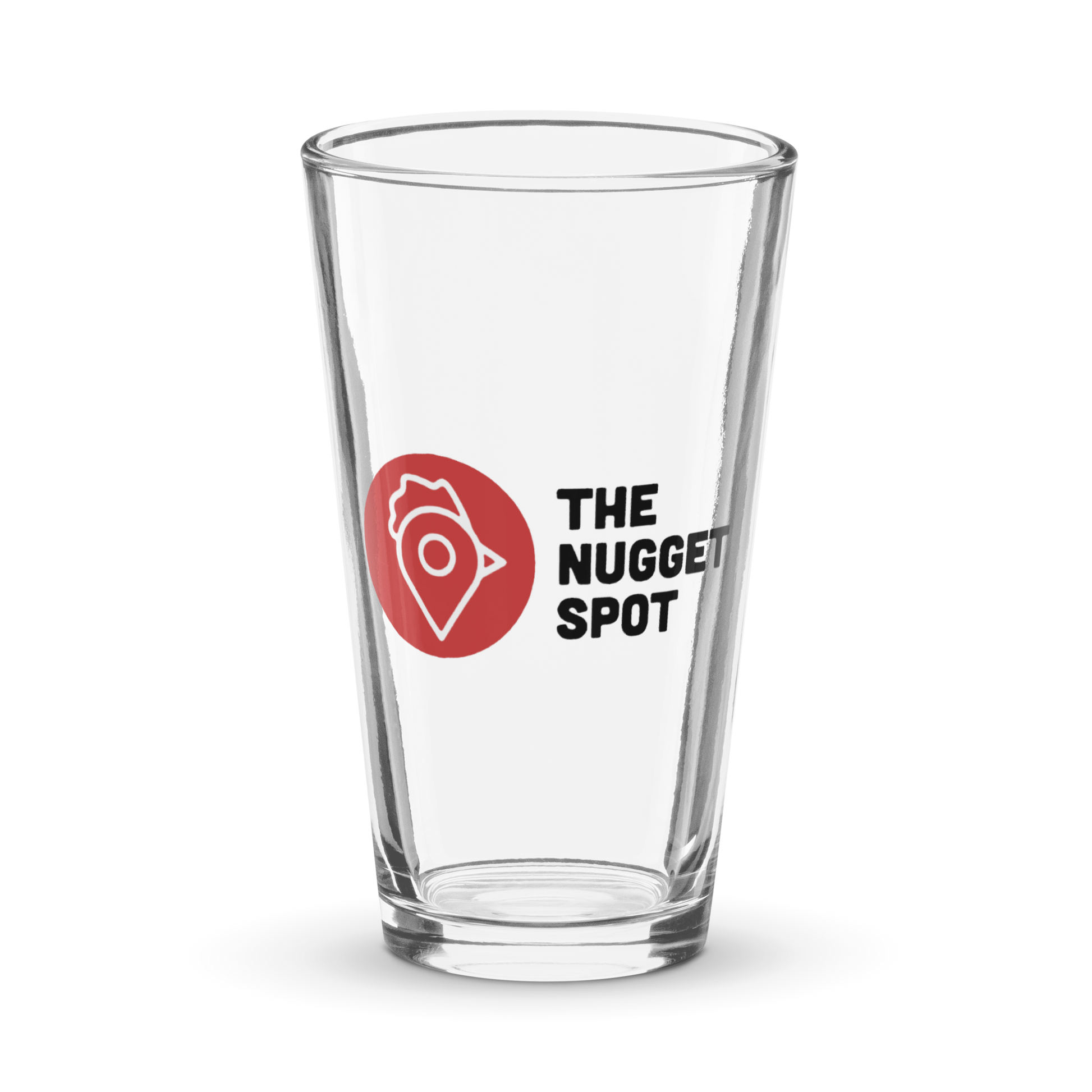 The Nugget Spot 16oz Pint Glass with red and white logo on transparent background – sleek, durable, UV-printed glass.